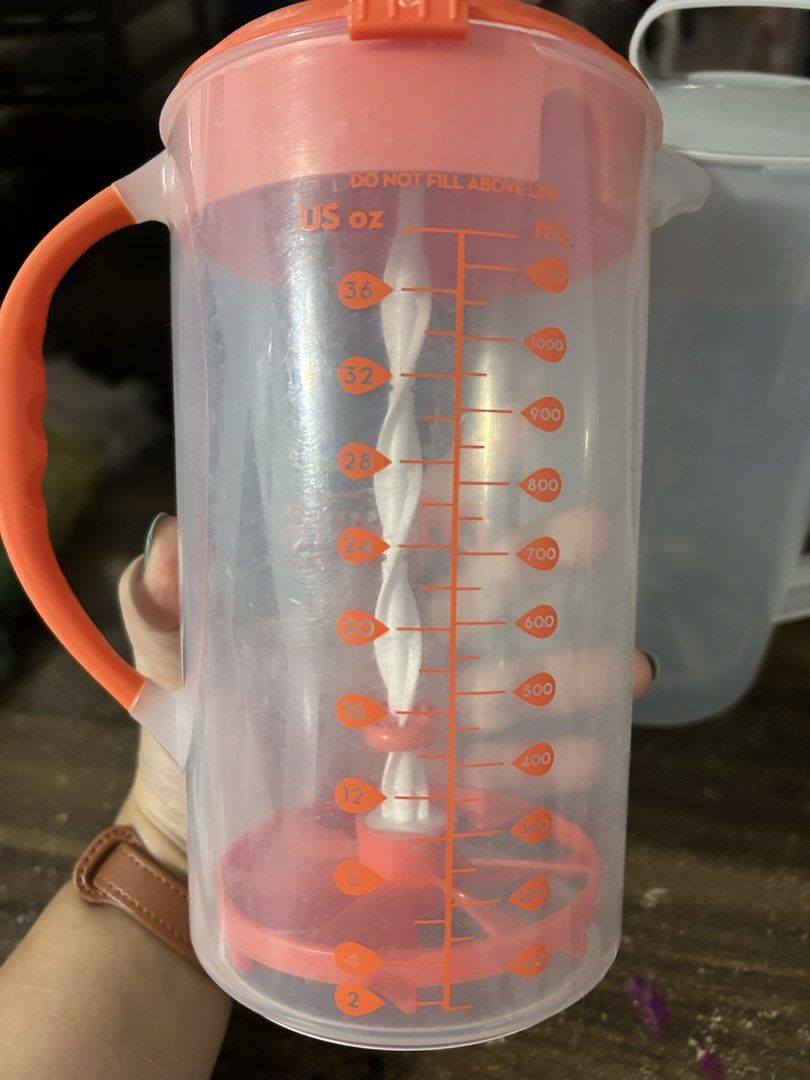 Dr. Brown's Natural Flow Formula Dispenser Pitcher (Category: Breastfeeding & Bottle Feeding) located in Las Pinas. Submitted by jacobstoyland (Listing ID 1440163570, Image 2). Description: - Effortless formula preparation for busy parents. - Clear measurement markings in US oz and mL. - Built-in whisk for smooth and efficient mixing. - Secure grip with orange lid and handle. - Ideal for travel and on-the-go feeding..