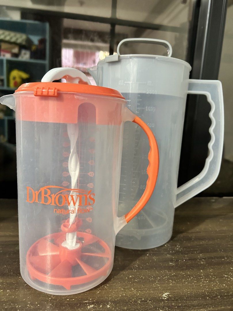 Dr. Brown's Natural Flow Formula Dispenser Pitcher (Category: Breastfeeding & Bottle Feeding) located in Las Pinas. Submitted by jacobstoyland (Listing ID 1440163570, Image 1). Description: - Effortless formula preparation for busy parents. - Clear measurement markings in US oz and mL. - Built-in whisk for smooth and efficient mixing. - Secure grip with orange lid and handle. - Ideal for travel and on-the-go feeding..