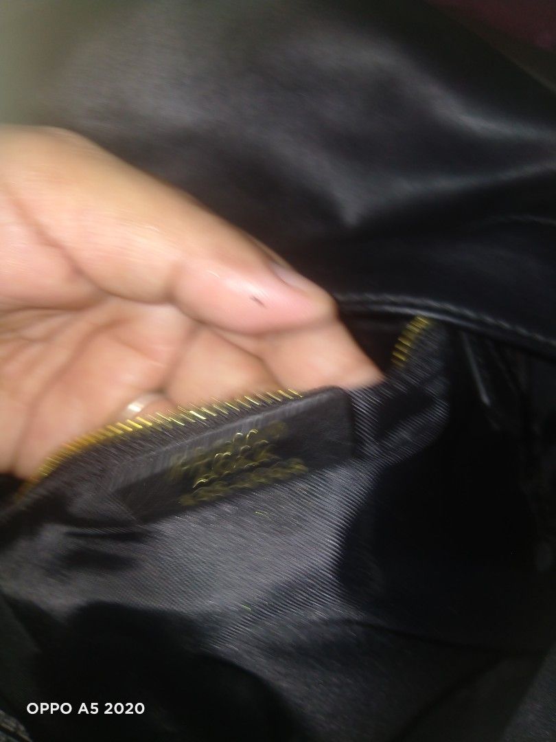 Fendi Monster Backpack Black Gold Eyes (Category: Backpacks) located in Manila. Submitted by chanlice0834788 (Listing ID 1440018556, Image 3). Description: - Stylish black Fendi backpack - Iconic gold monster eyes - Spacious main compartment with red interior lining - Front zippered pocket - RFID label for authenticity - Made in Italy.