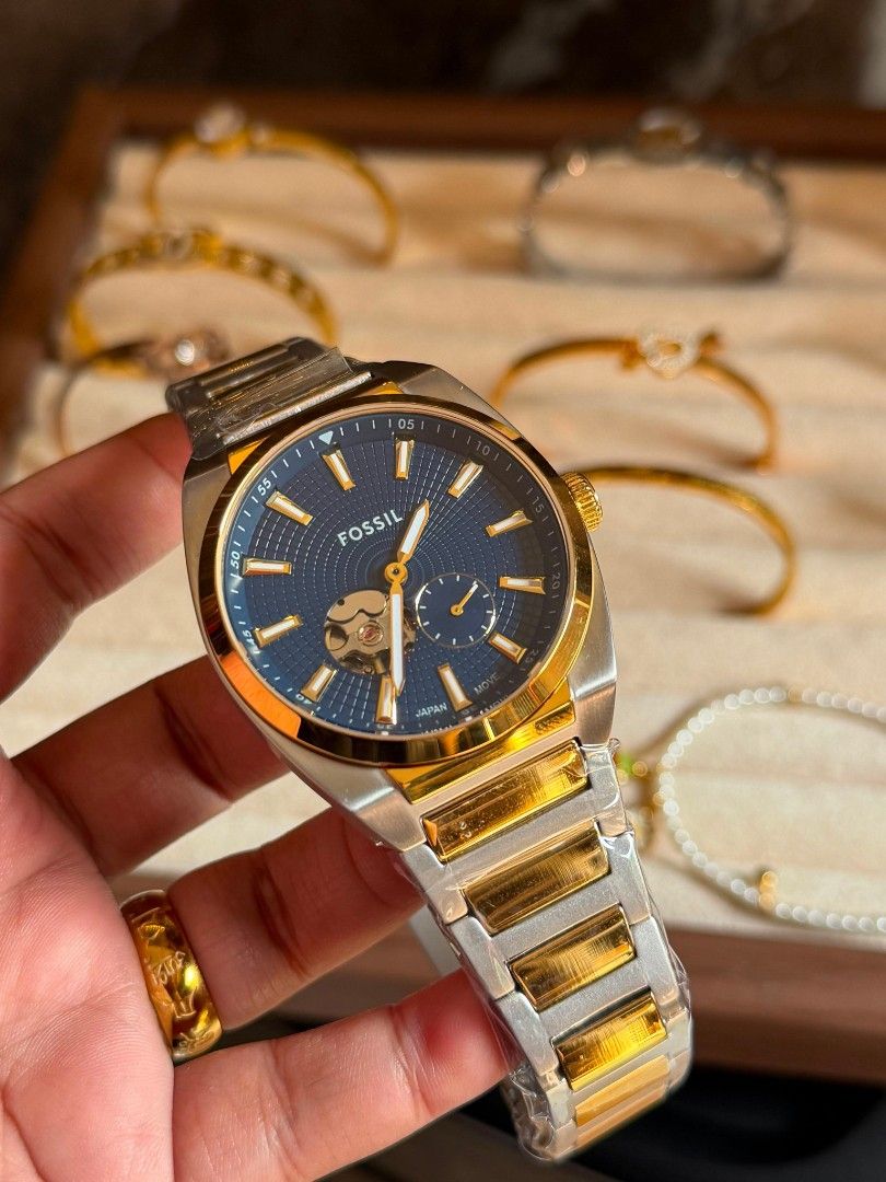 Fossil Automatic Stainless Steel Blue Dial Men's Watch (Category: Men's Watches) located in Manila. Submitted by maricelbal37348 (Listing ID 1440066358, Image 3). Description: - Elegant Fossil automatic watch - Striking blue dial with gold-tone accents - Durable stainless steel bracelet - Exhibition case back to view the automatic movement - Adds a sophisticated touch to any outfit.