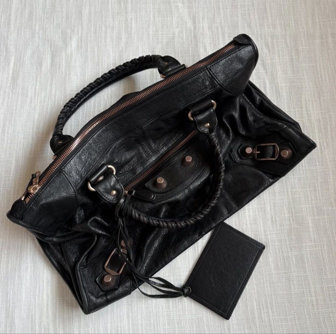 GIANTSTUD vintage leather work tote (Category: Luxury Bags & Wallets) located in Quezon City. Submitted by ccloset.cleanup (Listing ID 1440133601, Image 3). Description: GIANTSTUD vintage leather work tote SOUGHT-AFTER piece, Balen Work inspired but is genuine leather & lampo zipped, rosegold hardware, intact mirror, lightly used, 9/10 overall condition! Flat lay measurements: 45cm Length 27cm Height 20cm Width .