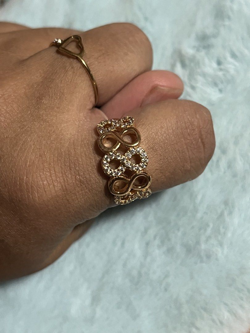 Gold Infinity Ring with Crystals adjustable (Category: Rings) located in Mandaue City. Submitted by chuchi152615 (Listing ID 1440025983, Image 3). Description: - Elegant gold-toned ring - Features multiple infinity symbols - Adorned with sparkling crystals - Adjustable for a comfortable fit - Perfect for everyday glamour or as a gift.