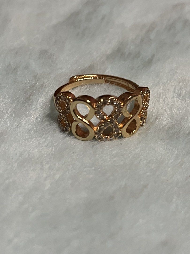 Gold Infinity Ring with Crystals adjustable (Category: Rings) located in Mandaue City. Submitted by chuchi152615 (Listing ID 1440025983, Image 2). Description: - Elegant gold-toned ring - Features multiple infinity symbols - Adorned with sparkling crystals - Adjustable for a comfortable fit - Perfect for everyday glamour or as a gift.