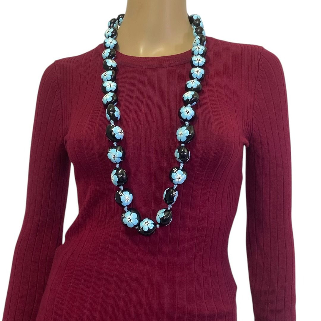 Hawaii Polished Black Kukui Nut Blue Hibiscus Flowers Leis Necklace (Category: Necklaces) located in Cebu City. Submitted by posh_avenue888 (Listing ID 1440111937, Image 2). Description: In very good condition. From Japan. 34 inches..