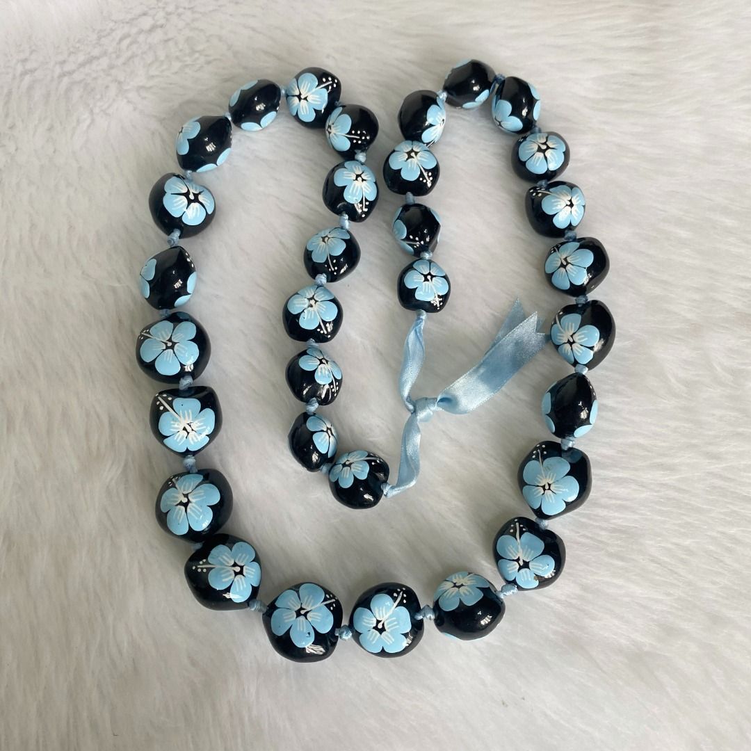 Hawaii Polished Black Kukui Nut Blue Hibiscus Flowers Leis Necklace (Category: Necklaces) located in Cebu City. Submitted by posh_avenue888 (Listing ID 1440111937, Image 3). Description: In very good condition. From Japan. 34 inches..