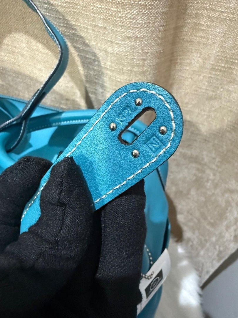 Hermes Lindy Turquoise Leather Shoulder Bag (Category: Luxury Bags & Wallets) located in Las Pinas. Submitted by cocoandcrunch (Listing ID 1440097730, Image 3). Description: For Sale: Vintage Hermès Lindy 34 in Blue Paon Swift leather with Palladium hardware. Purchased from a reputable seller on carousell. Beautiful vintage piece with a relaxed, well-loved character. Please manage expectations as this is a pre-owned bag and only the items shown i