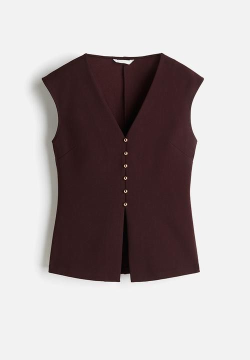 H&M Burgundy V-Neck Sleeveless Vest Top with Gold Buttons (Category: Sleeveless) located in Singapore. Submitted by lltw29 (Listing ID 1440069690, Image 1). Description: - Chic burgundy vest top - Flattering V-neck design - Sleeveless for comfort - Elegant gold button detailing - Modern split hem - Perfect for layering or wearing on its own.