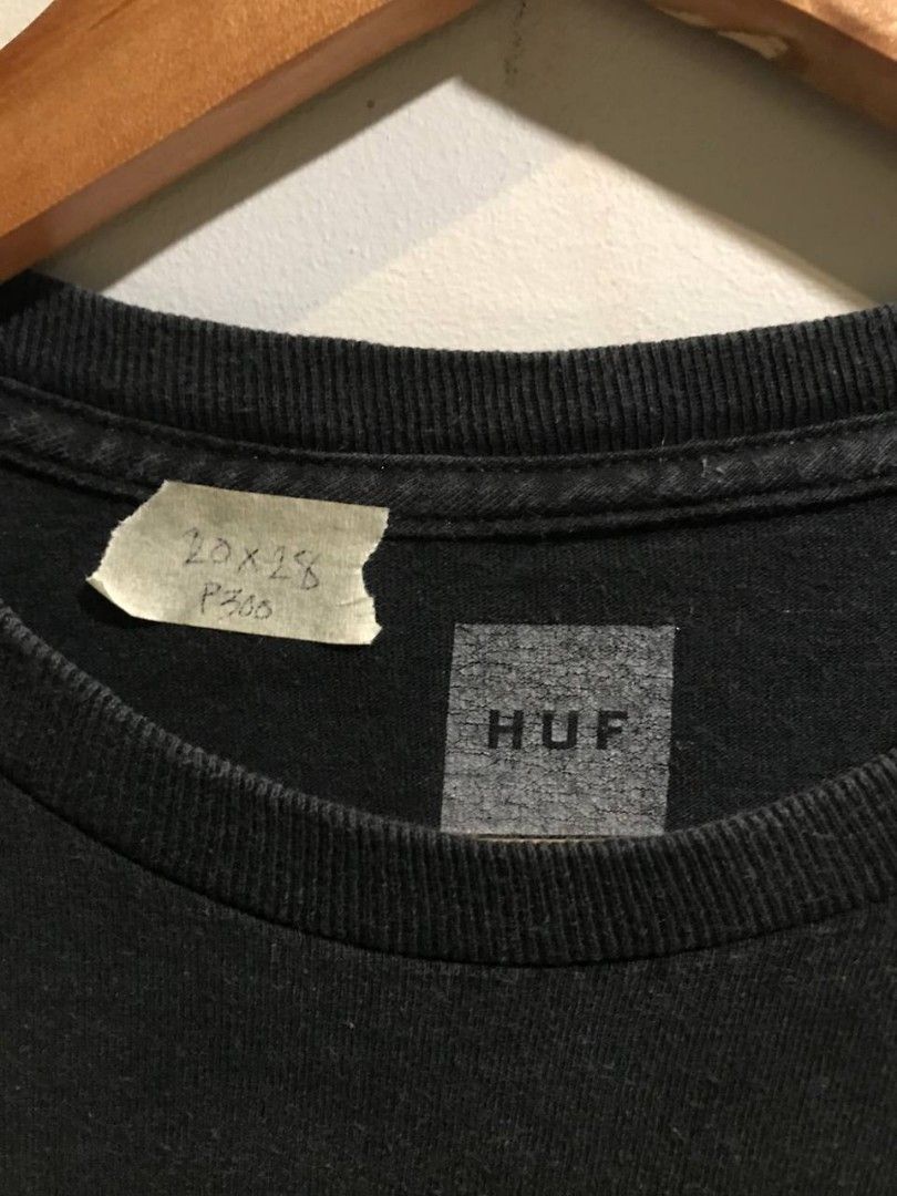 HUf x Spitfire Graphic T-Shirt (Category: Tshirts & Polo Shirts ) located in Manolo Fortich. Submitted by waddupdems (Listing ID 1440028892, Image 2). Description: - Brand: HUF - Color: Black - Size: 20x28 dimes - Front Design: Small HUF logo - Back Design: Large fiery 'H' logo with Spitfire graphic - Style: Graphic T-Shirt, Streetwear.