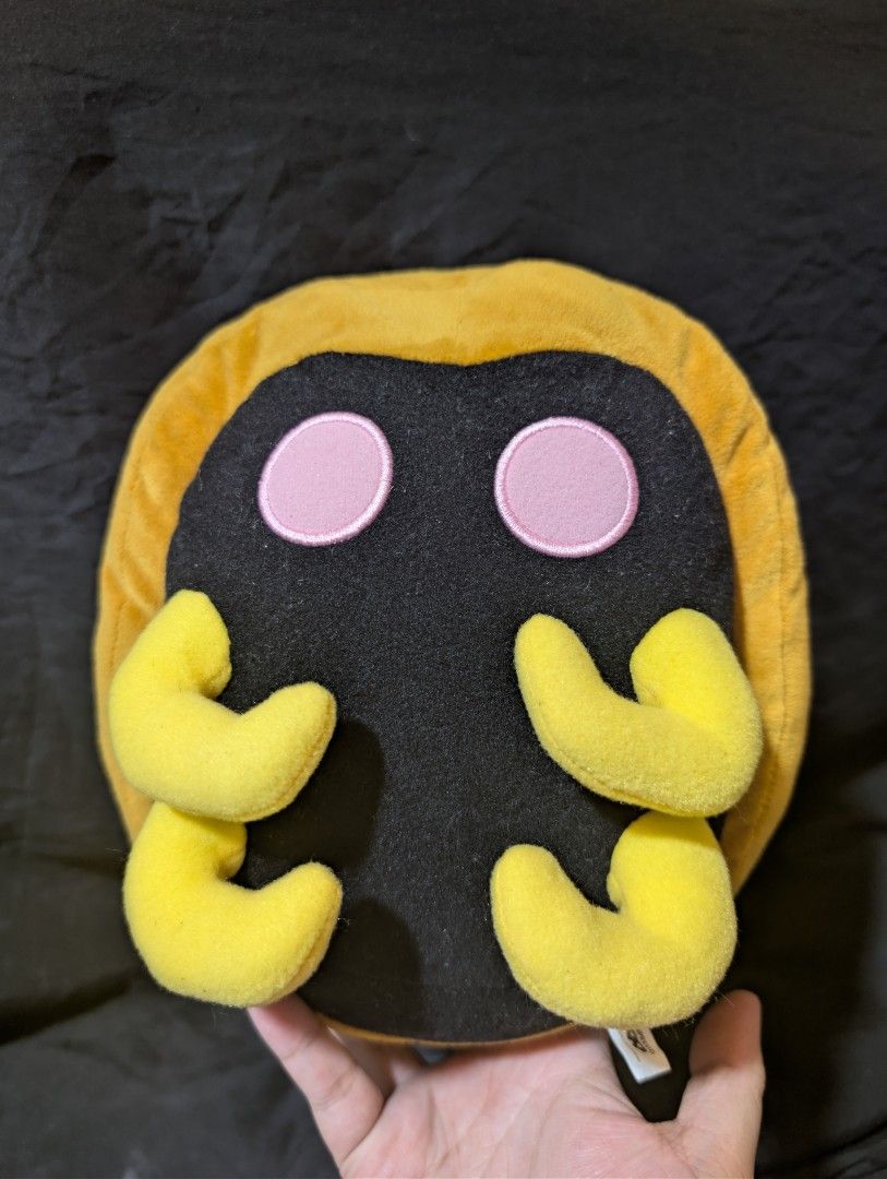 kabuto banpresto pokemon stuffed toy (Category: Plushies & Soft Toys) located in Malabon City. Submitted by apatoys (Listing ID 1440184083, Image 1). Description: - Adorable black plush toy - Features two pink circular eyes - Yellow outer edge and four curved yellow appendages - Made with soft, cuddly plush material - Ideal for fans of cute characters, collections, or as a gift.