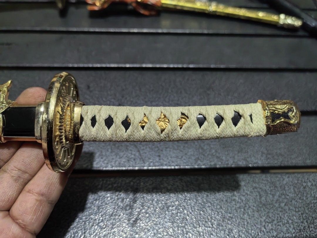 Katana Sword Toy Display (Category: Vintage Collectibles) located in Cebu City. Submitted by dudes_villanueva (Listing ID 1440018074, Image 2). Description: Kat-ana Sord Display Model Material: Metal Plated Like New 📌In excellent condition. 📌Tradition Handle 📌No Edge. Length: 15.5 inches 2 Pcs. available.