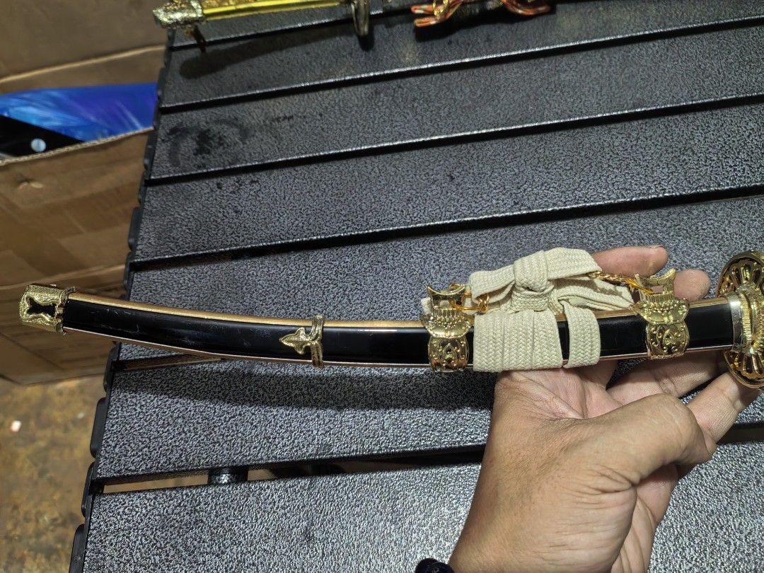 Katana Sword Toy Display (Category: Vintage Collectibles) located in Cebu City. Submitted by dudes_villanueva (Listing ID 1440018074, Image 3). Description: Kat-ana Sord Display Model Material: Metal Plated Like New 📌In excellent condition. 📌Tradition Handle 📌No Edge. Length: 15.5 inches 2 Pcs. available.