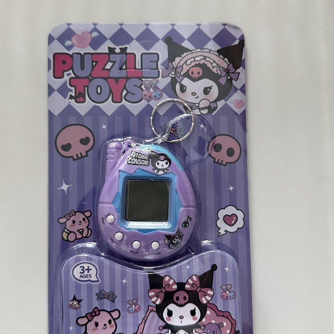 Kuromi Tamagotchi Virtual Pet Keychain Toy 1pcs (Category: Interactive Toys) located in Singapore. Submitted by amigoshop (Listing ID 1440044477, Image 2). Description: - Adorable Kuromi-themed virtual pet keychain - Simply insert the card to start playing - Perfect for retro gaming fans - Great cute collectible - Ideal nostalgic gift.