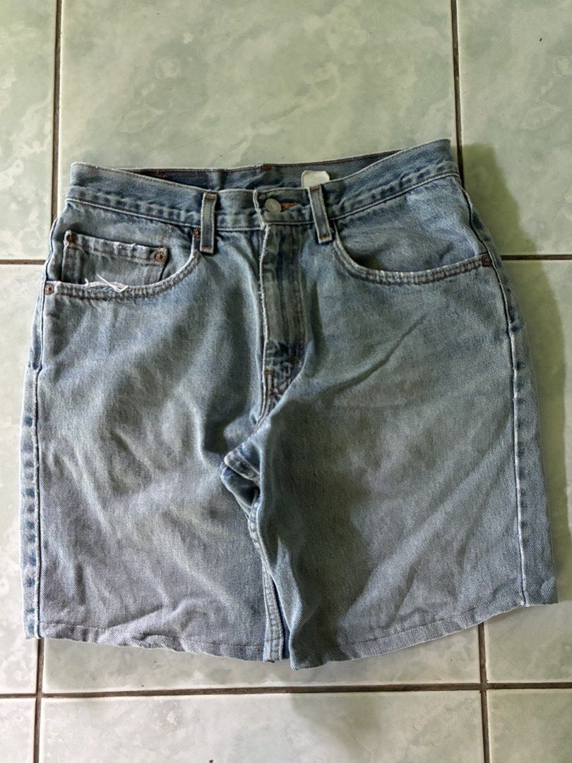 Levi's Denim Shorts Light Wash (Category: Shorts) located in Batangas. Submitted by jinventoryarchive (Listing ID 1440125364, Image 1). Description: 31 waist 18 length 10 hem - Classic light wash denim shorts from Levi's - Button and zip fly closure - Belt loops for customization - Iconic Levi's stitching on back pockets - Versatile for casual outfits.