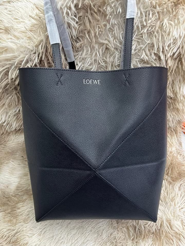 Loewe Tote Bag (Category: Luxury Bags & Wallets) located in Manila. Submitted by bagsandmanymanymore1 (Listing ID 1440075450, Image 1). Description: Loewe Tote Bag Genuine leather Actual picture posted Rare to find Serial number Please read before you order 👉🏻❗️Payment first before shipping ❗️Cut off time of payment 11am sameday delivery ❗️NO MEET UP / NO PICK UP ❗️ORDER CANNOT BE CANCELLED ❗️PLEASE DON’T BUY IF YOU ARE IN DOUBT ❗️NO RETURN! NO