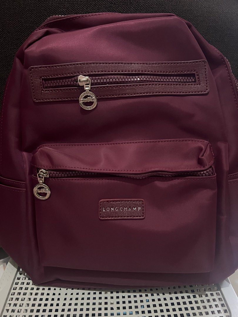 Longchamp Backpack Nylon (Category: Backpacks) located in Bacoor. Submitted by faith.hope.love28 (Listing ID 1440044096, Image 2). Description: - Stylish and practical Longchamp nylon backpack - Multiple zippered compartments for organized storage - Available in a variety of colors - Perfect for everyday use, travel, or school.
