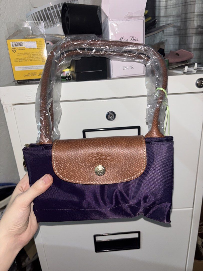 Longchamp Le Pliage (Category: Shoulder Bags) located in Cavite. Submitted by declutteringthingzz (Listing ID 1440126984, Image 1). Description: From Australia Purple Color Long handle .