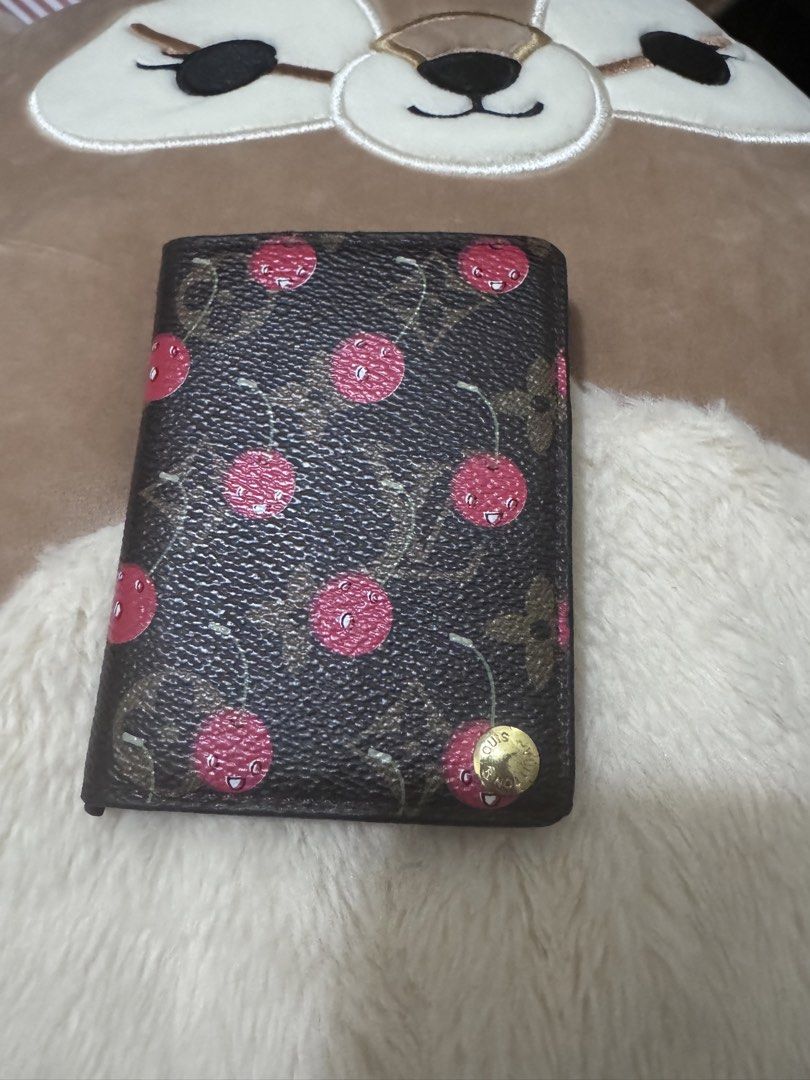 Louis Vuitton Cherry Monogram Bifold Wallet (Category: Luxury Bags & Wallets) located in Quezon City. Submitted by kerolrocks (Listing ID 1440160206, Image 1). Description: - Louis Vuitton Monogram canvas wallet - Playful cherry print detail - Compact bifold design - Slim profile, fits easily in pockets or small bags - Secure snap closure.