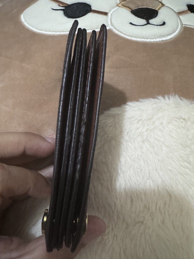Louis Vuitton Cherry Monogram Bifold Wallet (Category: Luxury Bags & Wallets) located in Quezon City. Submitted by kerolrocks (Listing ID 1440160206, Image 3). Description: - Louis Vuitton Monogram canvas wallet - Playful cherry print detail - Compact bifold design - Slim profile, fits easily in pockets or small bags - Secure snap closure.