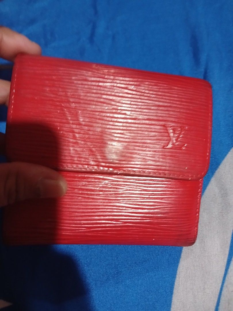 Louis Vuitton Epi Leather Red Bifold Wallet (Category: Luxury Bags & Wallets) located in Marikina City. Submitted by laila15 (Listing ID 1440176069, Image 3). Description: - Authentic Louis Vuitton bifold wallet - Vibrant red Epi leather - Coin compartment with snap closure - Multiple card slots - Made in Spain - Stylish and practical for everyday use Available .