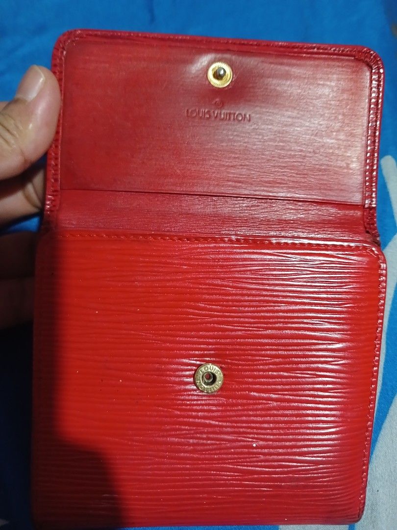 Louis Vuitton Epi Leather Red Bifold Wallet (Category: Luxury Bags & Wallets) located in Marikina City. Submitted by laila15 (Listing ID 1440176069, Image 2). Description: - Authentic Louis Vuitton bifold wallet - Vibrant red Epi leather - Coin compartment with snap closure - Multiple card slots - Made in Spain - Stylish and practical for everyday use Available .