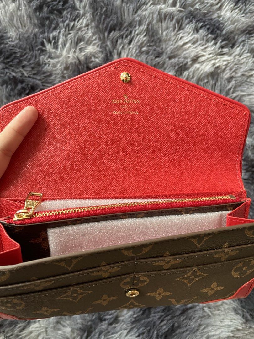 Louis Vuitton Monogram Envelope Wallet Red Trim (Category: Luxury Bags & Wallets) located in Manila. Submitted by izxbll_declutters (Listing ID 1440020477, Image 2). Description: PRICE STILL NEGO!! - Authentic Louis Vuitton wallet - Classic Monogram canvas - Vibrant red trim and corner details - Secure snap closure - Red leather interior lining - Zippered coin pocket - Includes original dust bag - Includes authenticity card.