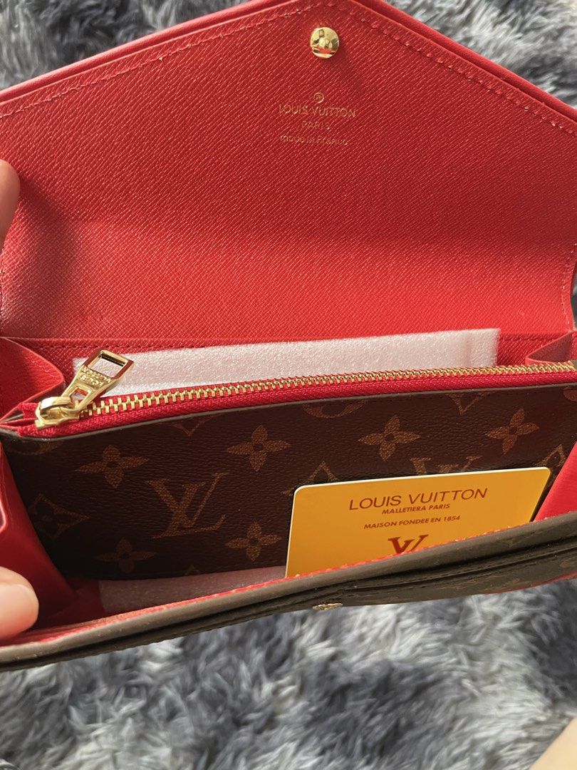 Louis Vuitton Monogram Envelope Wallet Red Trim (Category: Luxury Bags & Wallets) located in Manila. Submitted by izxbll_declutters (Listing ID 1440020477, Image 3). Description: PRICE STILL NEGO!! - Authentic Louis Vuitton wallet - Classic Monogram canvas - Vibrant red trim and corner details - Secure snap closure - Red leather interior lining - Zippered coin pocket - Includes original dust bag - Includes authenticity card.