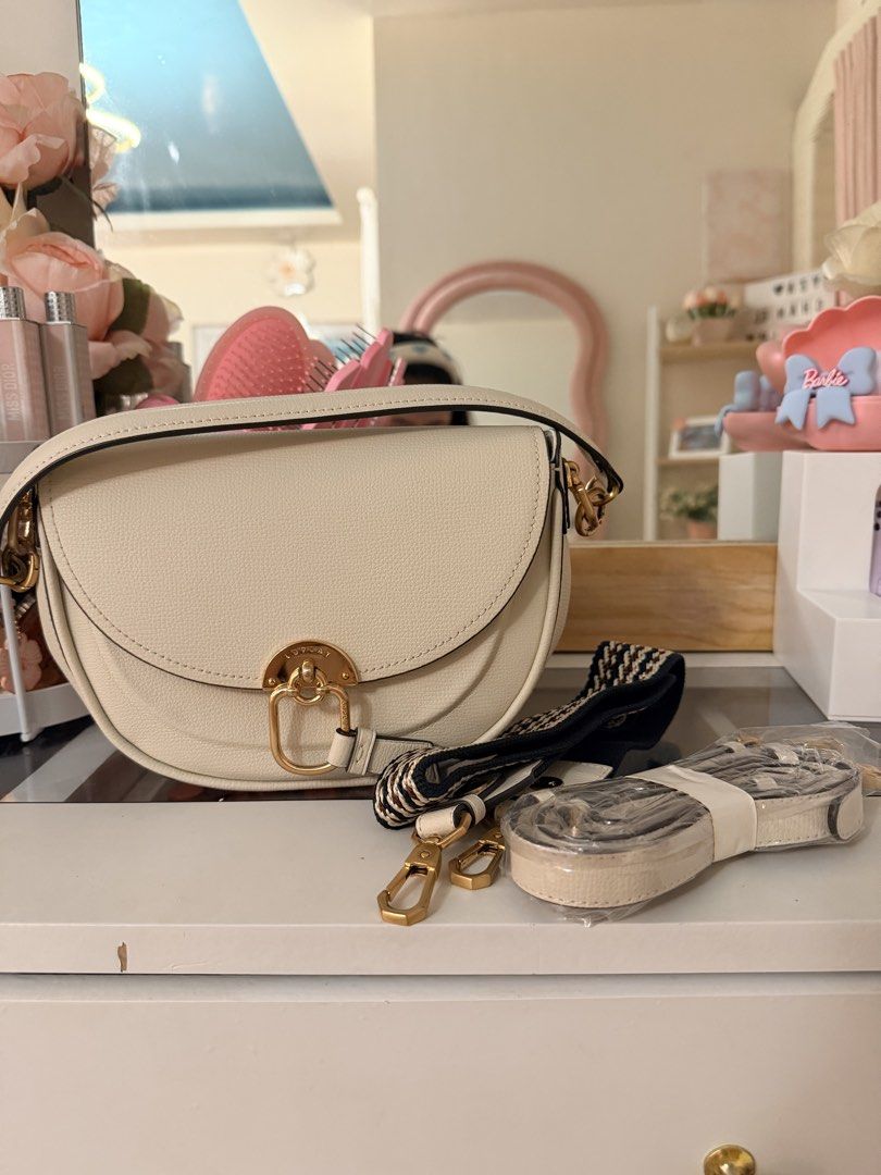 Lovecat Saddle Bag in cream white (Category: Luxury Bags & Wallets) located in San Pablo. Submitted by yzapulutan14 (Listing ID 1440174334, Image 1). Description: - Lovecat Saddle bag in cream white - Pebble leather - Gold hardware - 2 detachable crossbody straps (thick woven pattern & slim sling) - All personal use - RFS: too many bags, barely used this bag, decluttering.