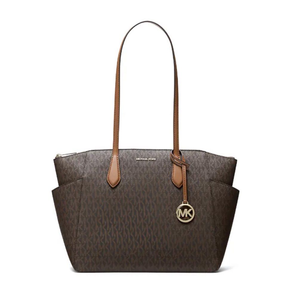 Michael Kors Signature Monogram Tote Bag with Leather Trim (Category: Luxury Bags & Wallets) located in Manila. Submitted by cespenorio (Listing ID 1440149168, Image 2). Description: - Authentic Michael Kors tote bag - Rfs: bought the wrong bag - Signature MK monogram print - Secure zip-top closure - Convenient side pockets - Classic tan leather trim and handles - Spacious design, perfect for daily use.