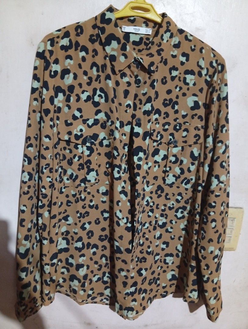 MNG Basics Leopard Print Long Sleeve Button-Up Shirt (Category: Shirts) located in Las Pinas. Submitted by magda09 (Listing ID 1440182758, Image 1). Description: - MNG Basics long-sleeved shirt - Stylish leopard print - Button-up design - Classic collar - Two chest pockets - Perfect for casual or semi-formal looks.