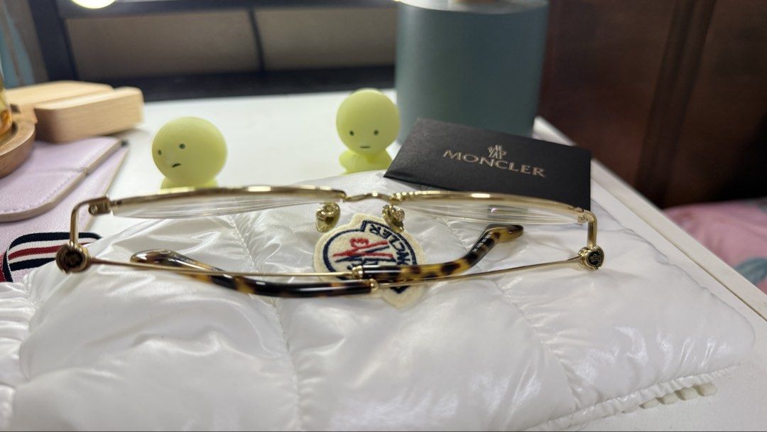 Moncler Gold Round Eyeglasses (Category: Sunglasses & Eyewear) located in Quezon City. Submitted by beabeys (Listing ID 1440131643, Image 3). Description: - Authentic Moncler eyeglasses - Classic gold-tone round frame - Stylish tortoiseshell pattern on temples - Lightweight and comfortable fit - Perfect for everyday wear or as a fashion statement -lens grade -2.00 .