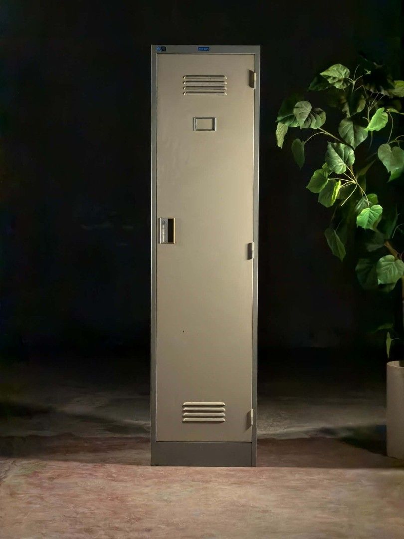 New Hope Metal Locker Cabinet (Category: Office Furniture & Fixtures) located in Valenzuela. Submitted by upcycle_things (Listing ID 1440106515, Image 2). Description: - Single door metal locker cabinet - Neutral beige exterior with decorative magnets - Interior features a hanging rod and shelf - Secure lock mechanism - Ventilation slots for air circulation - Great for office, gym, or school storage needs.