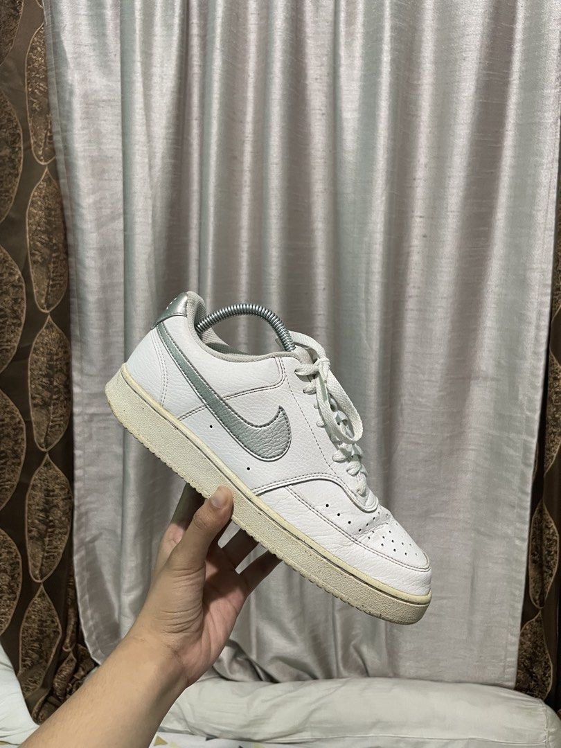Nike Court Vision Low White Silver (Category: Sneakers) located in Manila. Submitted by luckylabel26 (Listing ID 1440141765, Image 3). Description: - Classic white Nike low-top sneakers - Features subtle silver accents - Light cream-colored soles - Perfect for everyday wear - Shows some signs of use on soles and uppers, but plenty of life remaining.