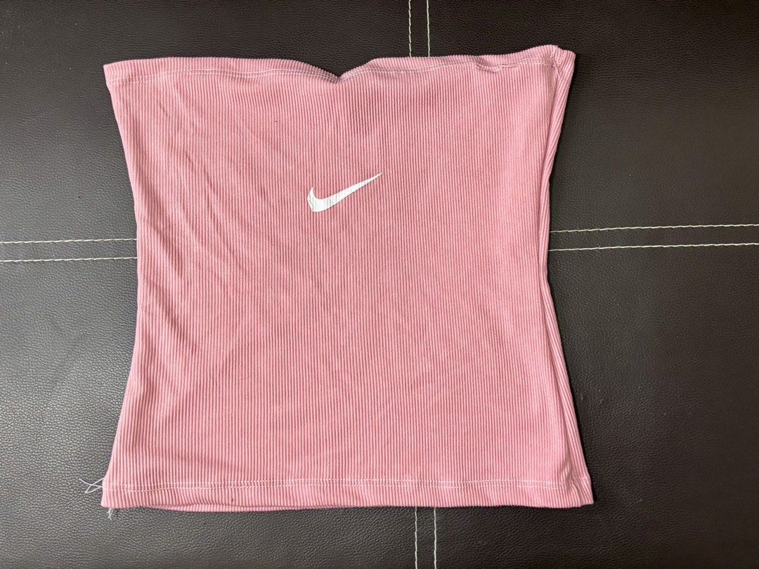 Nike Pink Ribbed Tube Top (Category: Others Tops) located in Manila. Submitted by janzelchum82542 (Listing ID 1440175534, Image 1). Description: - Pink ribbed tube top from Nike - Features iconic white Nike swoosh logo - Stretchy and comfortable material - Perfect for casual wear or layering - Stylish and sporty addition to your wardrobe.