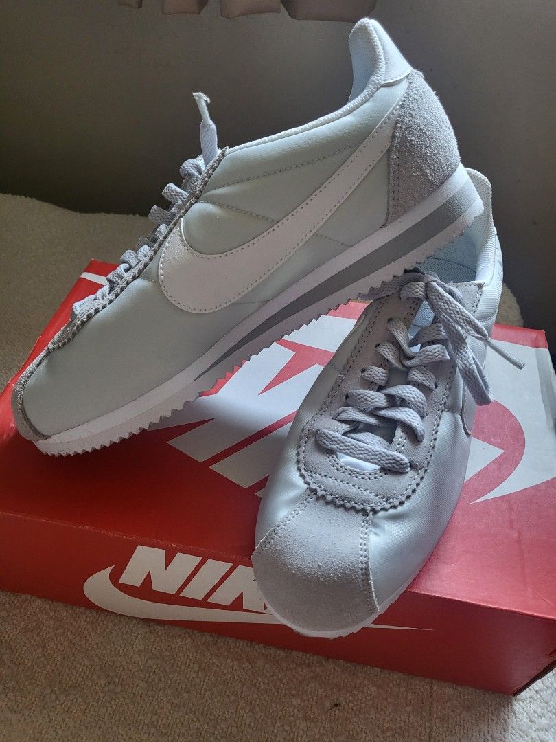 Nike WMNS Classic Cortez Nylon (Category: Sneakers) located in Muntinlupa City. Submitted by PeggyGirl (Listing ID 1440033555, Image 2). Description: - Authentic Nike WMNS Classic Cortez Nylon sneakers - Color: Pure Platinum/White - Classic silhouette with nylon and suede accents - Includes original Nike box - Size: 9 US Women's.