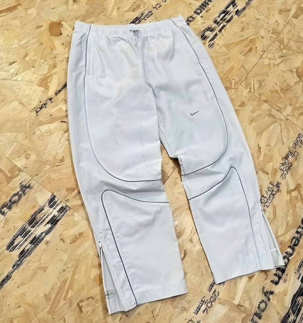 Nike x Corteiz RTW Track Pants (Reflective) (Category: Joggers) located in Dasmarinas. Submitted by renjielars (Listing ID 1440183785, Image 3). Description: Nike CRTZRTW track pants - Zippered ankles for customizable wear - Secure zippered pockets for essentials - Stylish reflective piping detail Good as new First to pay basis! Pass sa joy reserver Urdaneta, Pangasinan Loc Can ship via j&t or meetup around Urdaneta.