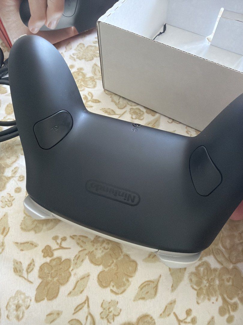 Nintendo Switch 2 Pro Controller with Charging Cable and Box (Category: Controllers) located in Quezon City. Submitted by markedison.bautista (Listing ID 1439994092, Image 2). Description: - Official Nintendo Switch Pro Controller - Includes original box - Includes charging cable - Comfortable and responsive for enhanced gaming - Ideal for extended play sessions.