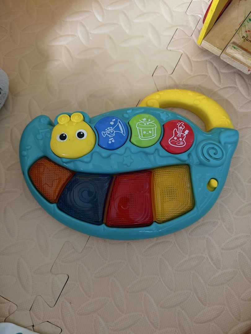 Playskool Giraffe, Elephant Plush, Music Toy, Shape Sorter (Category: Infant Playtime) located in Malolos. Submitted by pb96104 (Listing ID 1440118499, Image 2). Description: - Bundle of 4 baby toys - Includes Playskool giraffe with rolling balls - Peek-a-boo elephant plush - Musical keyboard with animal sounds - Wooden shape sorter cube with bead maze - Ideal for sensory play and early development. No batteries but all working Get all for 700.