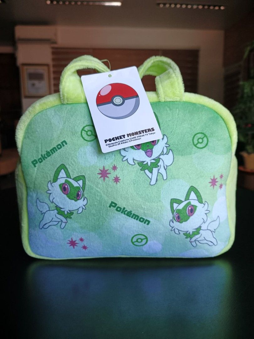 Pokemon Sprigatito Plush Bag with Tag (Category: Plushies & Soft Toys) located in Daet. Submitted by clarenejim72394 (Listing ID 1440044003, Image 2). Description: - Adorable and fluffy Sprigatito plush bag - Perfect for carrying small essentials - Features a zippered main compartment - Includes two comfortable handles - Officially licensed Pokemon merchandise - Made in Japan.