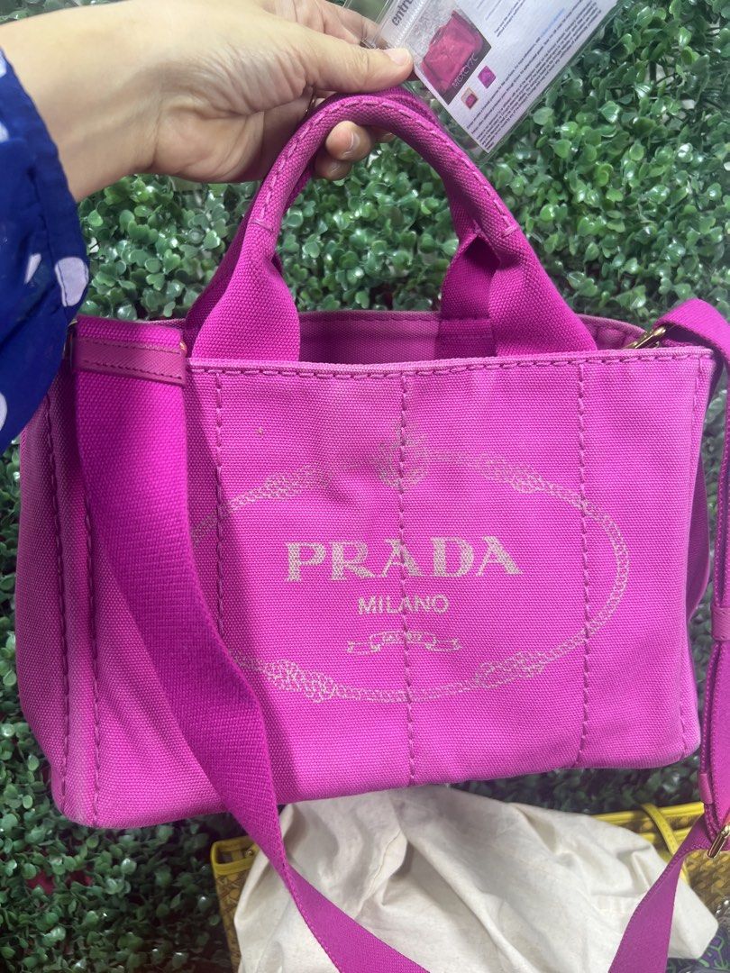 Prada Canapa Pink with Sling (Category: Luxury Bags & Wallets) located in Manila. Submitted by jonalyngal75237 (Listing ID 1440162890, Image 3). Description: - Authentic Prada Milano canvas tote bag - Vibrant pink color - Iconic Prada logo printed on front - Versatile: carry by top handles or adjustable shoulder strap - Spacious interior with zippered pocket - Perfect for everyday use.