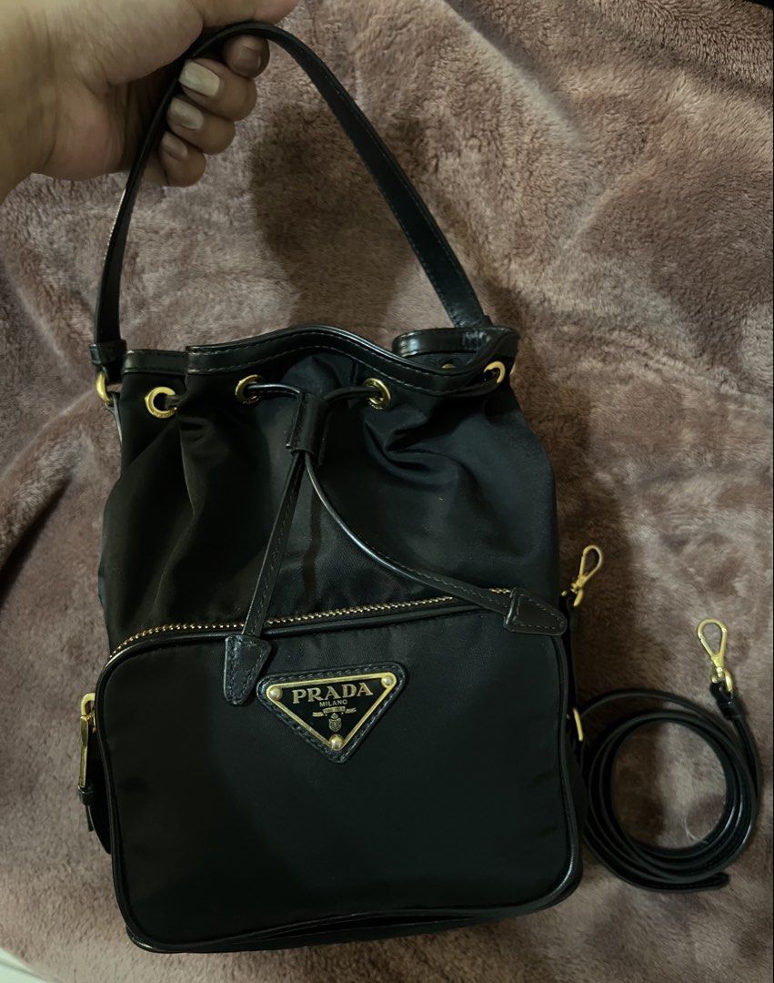 Prada Duet Re-Nylon Bucket Bag - Authentic (Category: Luxury Bags & Wallets) located in Manila. Submitted by niftyshopperph (Listing ID 1434229456, Image 3). Description: REPRICED FROM 55k DOWN TO 48K Bag ni Kathryn Bernardo! 🥰 No issues, in excellent condition! Gold na gold pa yung hardware, no fading. The perfect casual daily bag. Super lightweight and durable. Message me for detailed photos ❤️ Negotiable pa, direct pm na lang. Don’t be shy, I
