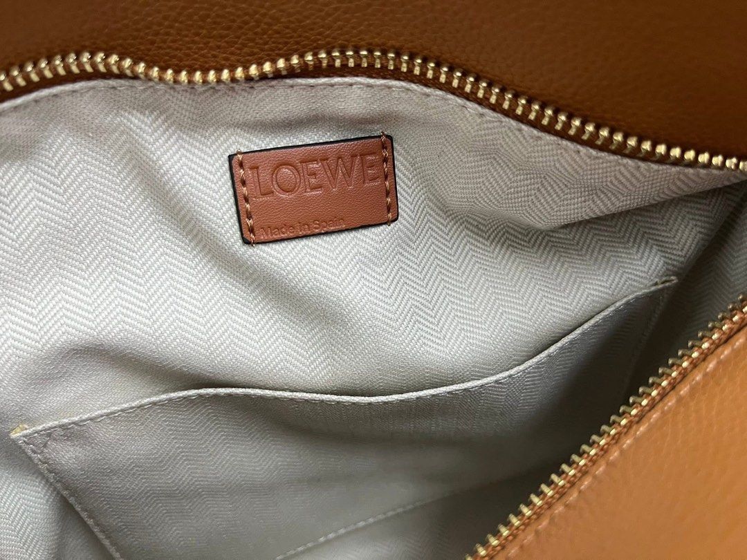 Preloved Loewe Puzzle (Category: Luxury Bags & Wallets) located in Manila. Submitted by bagsandshoesmanymore (Listing ID 1440076043, Image 3). Description: Preloved Loewe Size 25cm Actual picture posted Genuine leather Made in Spain Serial number Please read before you order 👉🏻❗️Payment first before shipping ❗️Cut off time of payment 11am sameday delivery ❗️NO MEET UP / NO PICK UP ❗️ORDER CANNOT BE CANCELLED ❗️PLEASE DON’T BUY IF YOU ARE IN DOU