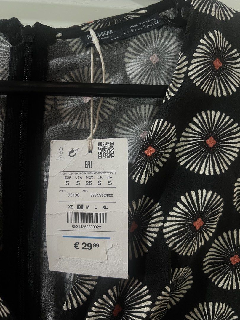 Pull & Bear Black Floral Print Cut-Out Mini Dress (Category: Dresses) located in Cagayan de Oro. Submitted by jeirn (Listing ID 1440007546, Image 3). Description: Retails at 2,200 - Brand: Pull & Bear - Style: Mini Dress - Color: Black with vibrant all-over floral print - Neckline: V-neck with unique cut-out detail - Closure: Tie front - Sleeves: Long sleeves - Occasion: Perfect for day or evening events.