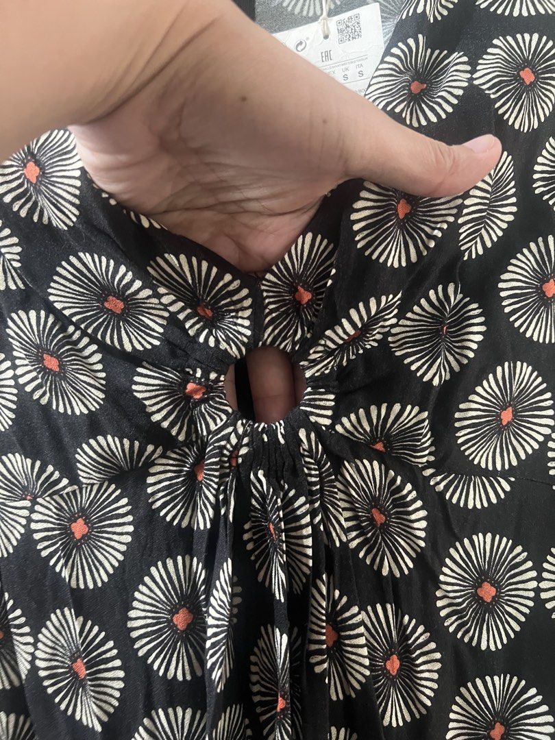Pull & Bear Black Floral Print Cut-Out Mini Dress (Category: Dresses) located in Cagayan de Oro. Submitted by jeirn (Listing ID 1440007546, Image 2). Description: Retails at 2,200 - Brand: Pull & Bear - Style: Mini Dress - Color: Black with vibrant all-over floral print - Neckline: V-neck with unique cut-out detail - Closure: Tie front - Sleeves: Long sleeves - Occasion: Perfect for day or evening events.