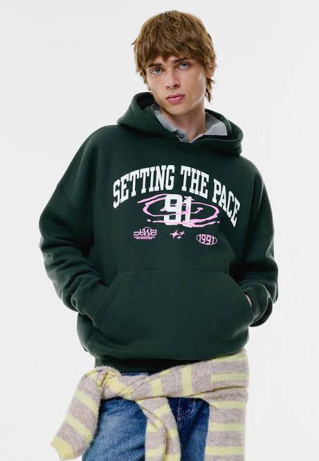 PULL & BEAR Dark Green Graphic Hoodie (Category: Hoodies) located in Quezon City. Submitted by lunaisse (Listing ID 1440081067, Image 2). Description: - Dark green hoodie - Bold 'Setting the Pace 91' graphic print on front - Additional smaller graphic details - Features a front pocket - Ideal for casual wear - Bought from DUBAI.