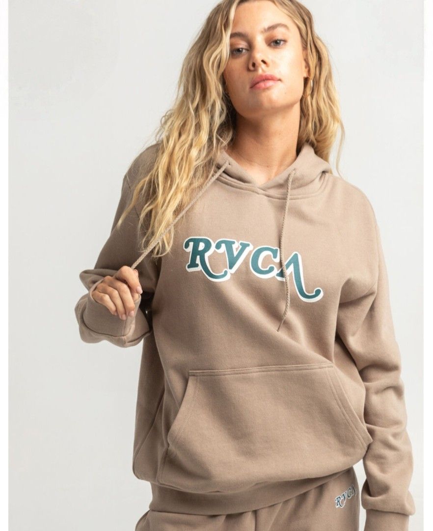 RVCA Hoodie Tan Brown (Category: Coats, Jackets and Outerwear) located in Caloocan City. Submitted by johnemmanu44152 (Listing ID 1440189172, Image 1). Description: - Cozy RVCA hoodie in a stylish tan brown color. - 21.5x25.5 - Features a unique graphic print on the front. - Includes a comfortable kangaroo pocket. - Ideal for everyday casual wear. - Made in China..