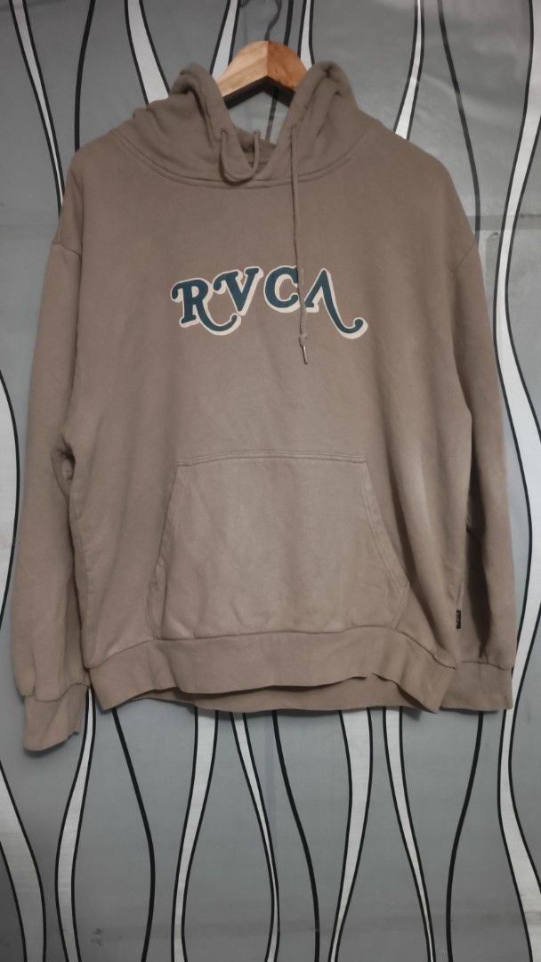 RVCA Hoodie Tan Brown (Category: Coats, Jackets and Outerwear) located in Caloocan City. Submitted by johnemmanu44152 (Listing ID 1440189172, Image 3). Description: - Cozy RVCA hoodie in a stylish tan brown color. - 21.5x25.5 - Features a unique graphic print on the front. - Includes a comfortable kangaroo pocket. - Ideal for everyday casual wear. - Made in China..
