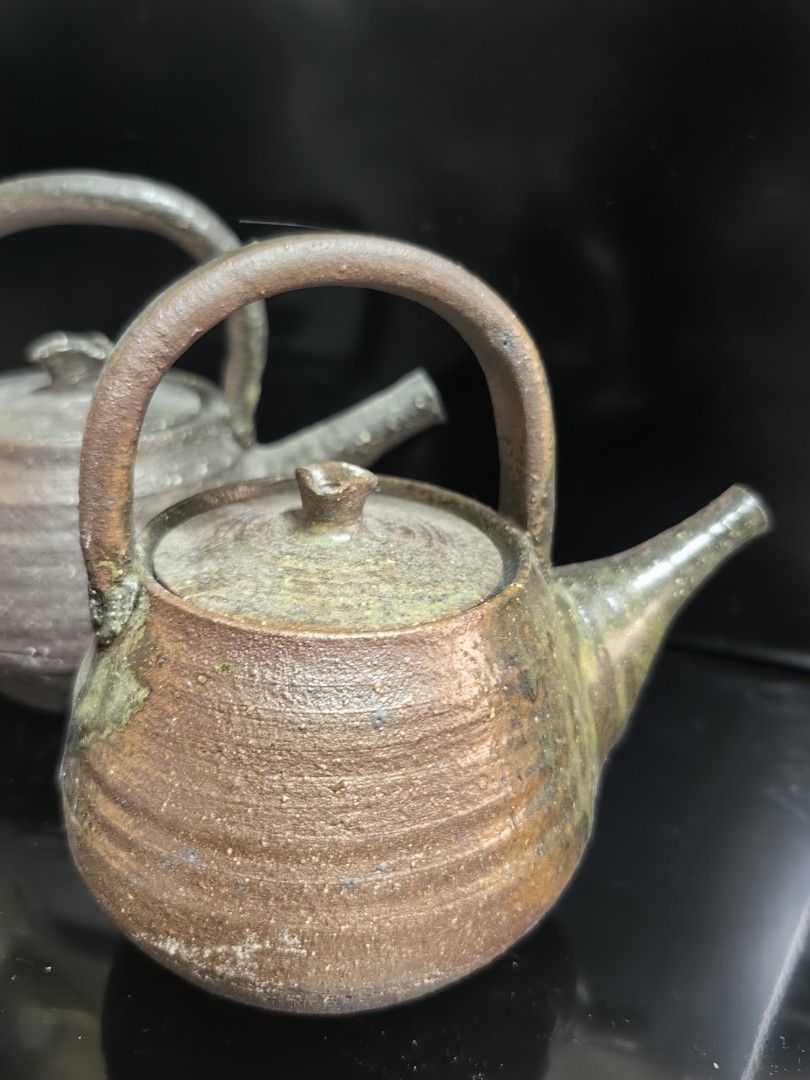 Set of 2 Vintage Ceramic Teapots (Category: Coffee & Tea Tableware) located in Rizal. Submitted by gkstcenit (Listing ID 1439997789, Image 2). Description: - Set of 2 vintage ceramic teapots - Unique rustic design with handle and spout - Perfect for display or serving tea - Adds a touch of vintage elegance - Earthy tones and textured finish for unique character.