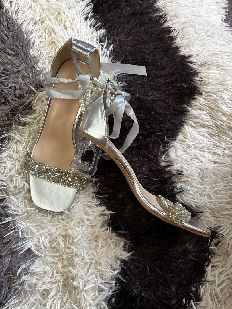Silver Embellished Pearl Strap Heels Size 38 (Category: Heels) located in Naic. Submitted by mancanescharlene (Listing ID 1440043775, Image 2). Description: Sparkling silver heels with rhinestone and pearl/ribbon ankle straps. Features a clear block heel. Perfect for parties and events. .