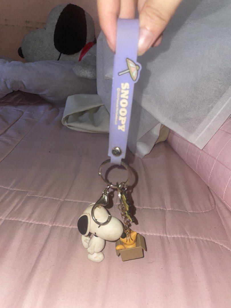 Snoopy Keychain with Dog House and Cat (Category: Toys & Games) located in Manila. Submitted by ionajjj (Listing ID 1440034696, Image 2). Description: - Adorable Snoopy keychain set - Features Snoopy, his dog house, a cat in a box, and Woodstock - Comes with a charming lavender strap - Includes a cute umbrella charm - Perfect accessory for bags, backpacks, and keys PRICE IS NEGOTIABLE. JUST SEND ME A PM :)).