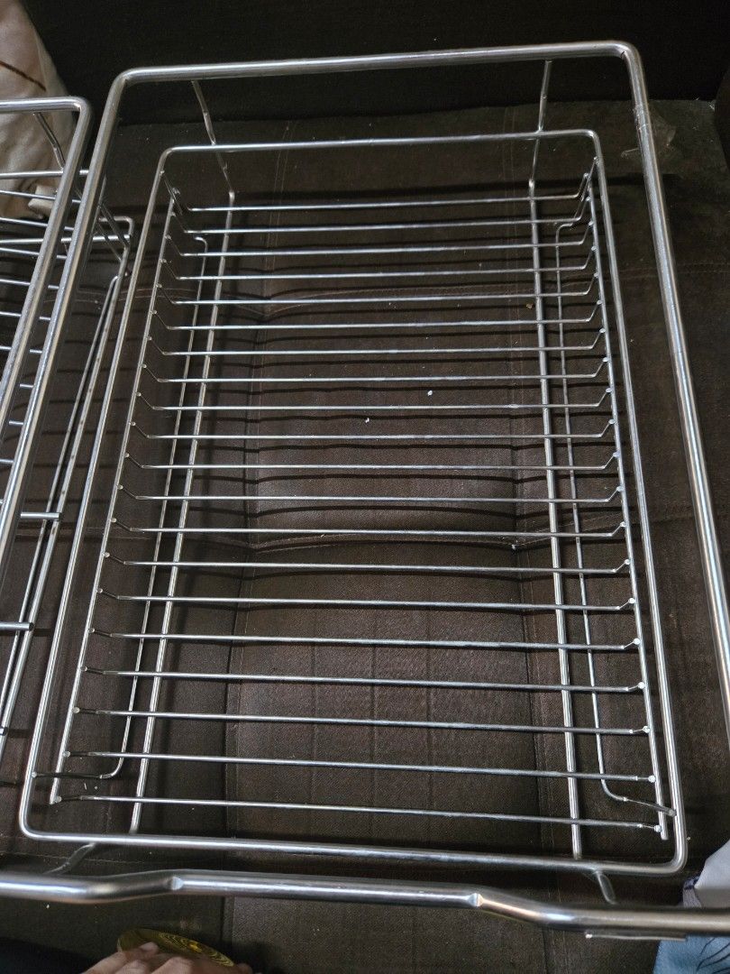 Stainless Steel Pull-Out Kitchen Cabinet Organizer (Category: Shelves, Cabinets & Racks) located in San Mateo. Submitted by prelovedmama12 (Listing ID 1440039682, Image 2). Description: - Stainless steel construction for durability. - Two-tier design for efficient storage. - Top tier with slots specifically for plates. - Bottom tier perfect for cups or bowls. - Smooth-gliding metal drawer slides included. - Maximizes cabinet space and keeps kitch
